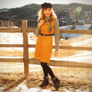 Grey sweater with yellow pinafore patterned scarf