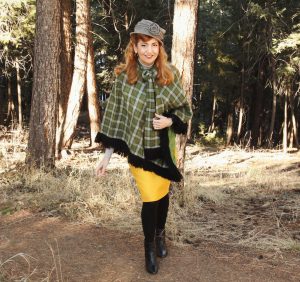 Green plaid poncho, yellow skirt and grey hat