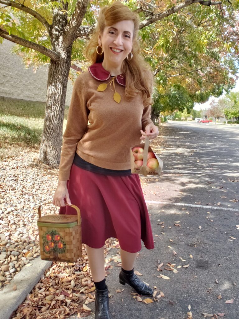 Girl in retro fall outfits with swing skirt, cardigan sweater and Peter Pan collar